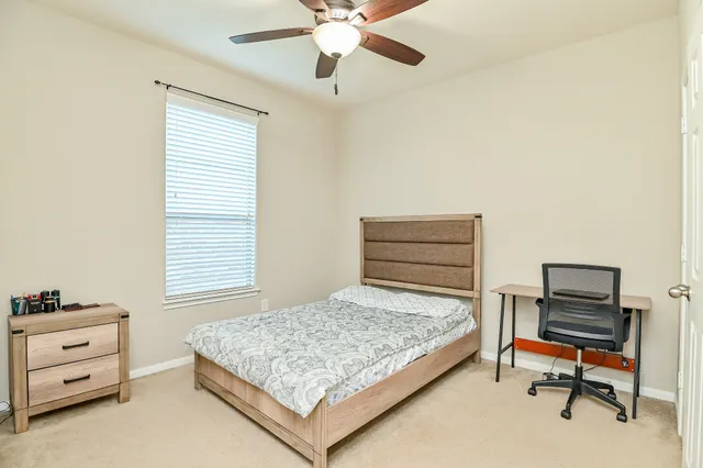a bedroom with a bed and furniture