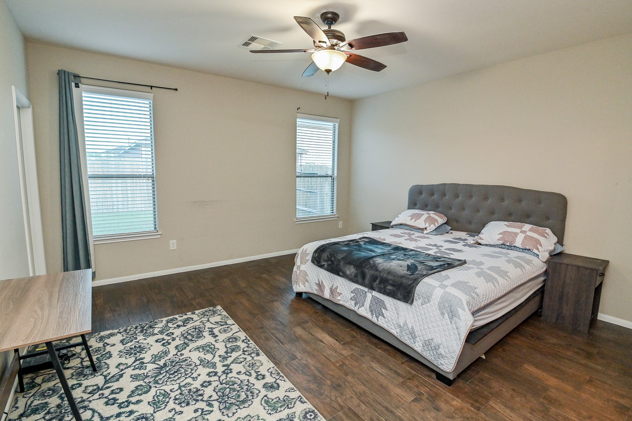 15406 Key Crest Lane Cypress, TX 77429 - Photo 33 of 47 a bedroom with a bed lamp and a window