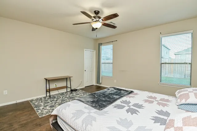 a bedroom with a bed and window