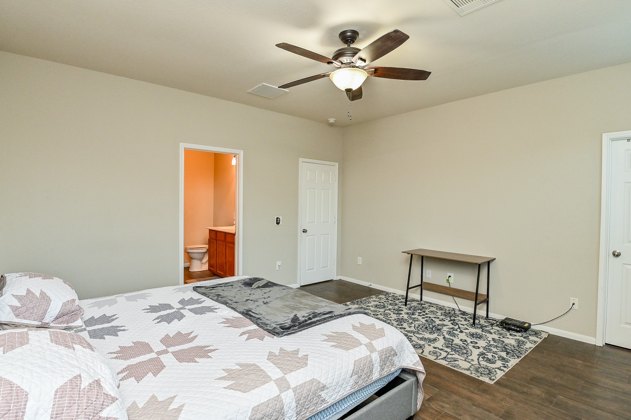 15406 Key Crest Lane Cypress, TX 77429 - Photo 35 of 47 a bedroom with a large bed and a chandelier