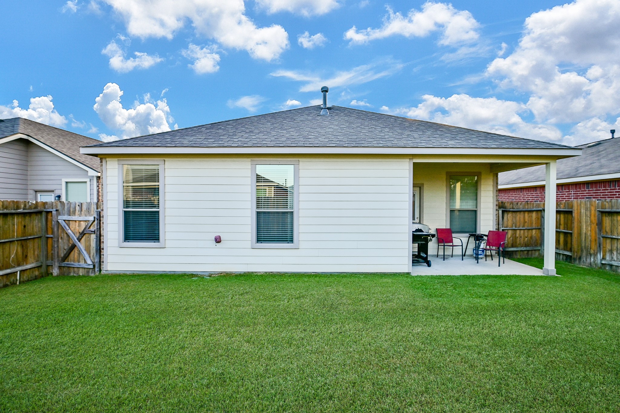 15406 Key Crest Lane Cypress, TX 77429 - Photo 46 of 47 a view of a backyard with basket ball court and a garage