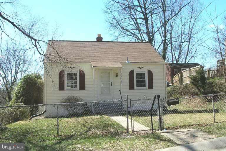 11512 Joseph Mill Road Silver Spring, MD 20906 - Photo 1 of 1 a view of a house with a yard