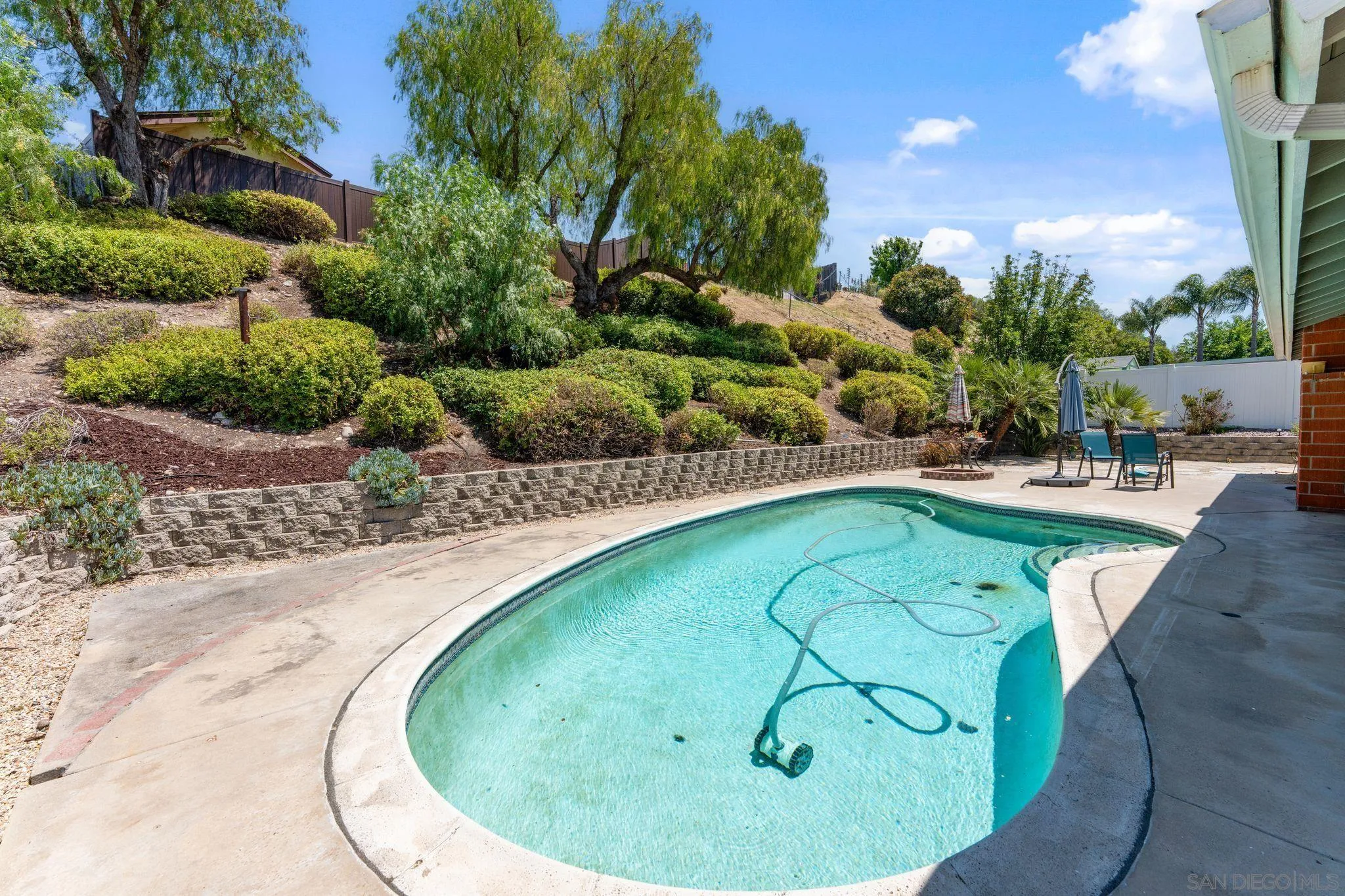10565 Strathmore Drive Santee, CA 92071 - Photo 3 of 59 a view of swimming pool with outdoor seating and green space