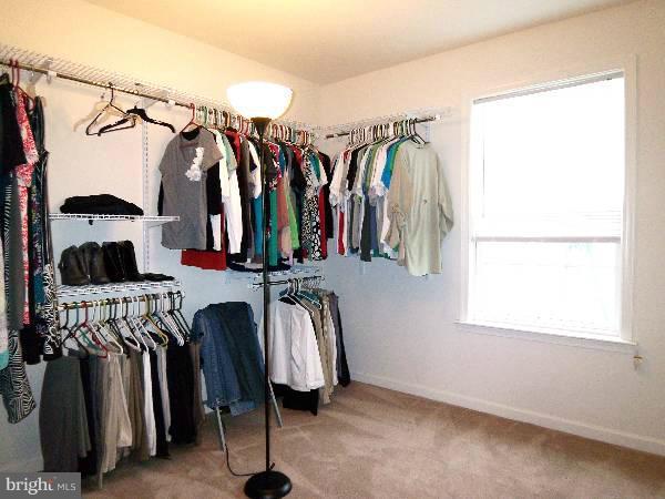 176 Shelby Road Inwood, WV 25428 - Photo 17 of 30 a view of walk in closet with clothes and shoes