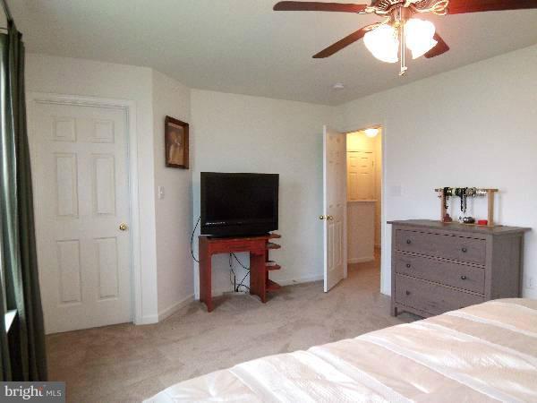 176 Shelby Road Inwood, WV 25428 - Photo 23 of 30 a bed room with a bed and a television