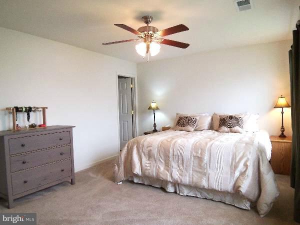 176 Shelby Road Inwood, WV 25428 - Photo 26 of 30 a bedroom with a bed and window