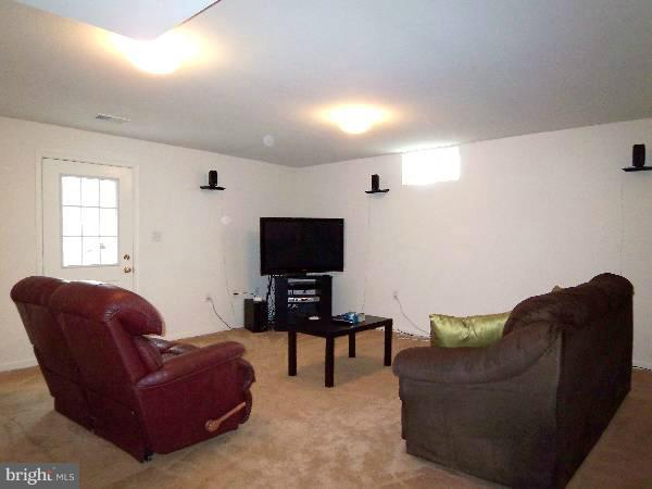 176 Shelby Road Inwood, WV 25428 - Photo 28 of 30 a living room with furniture and a flat screen tv