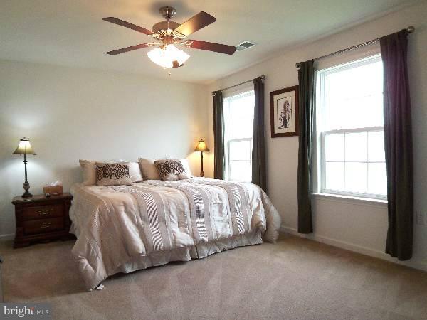 176 Shelby Road Inwood, WV 25428 - Photo 30 of 30 a spacious bedroom with a bed and a window