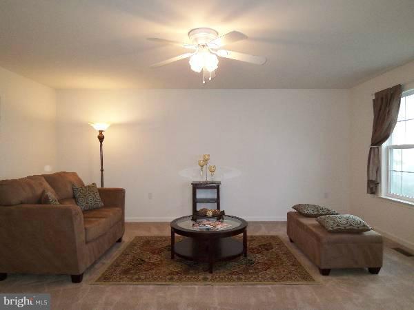 176 Shelby Road Inwood, WV 25428 - Photo 8 of 30 a living room with furniture and a fireplace