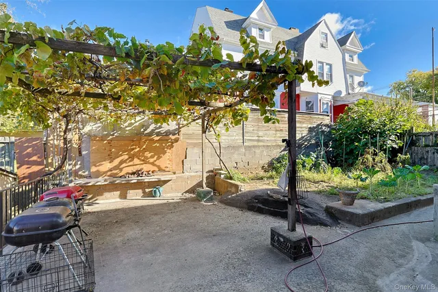 a backyard of a house with outdoor seating