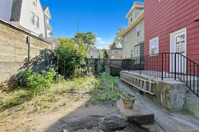 an aerial view of houses with yard