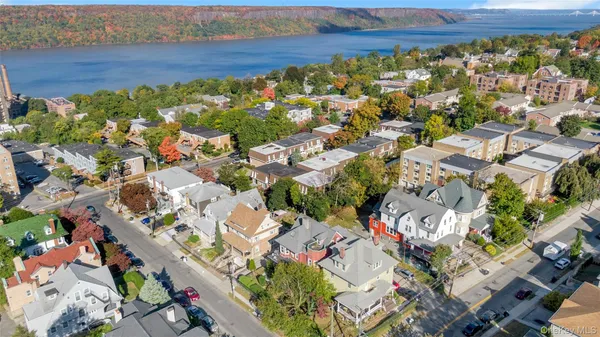an aerial view of residential houses with outdoor space