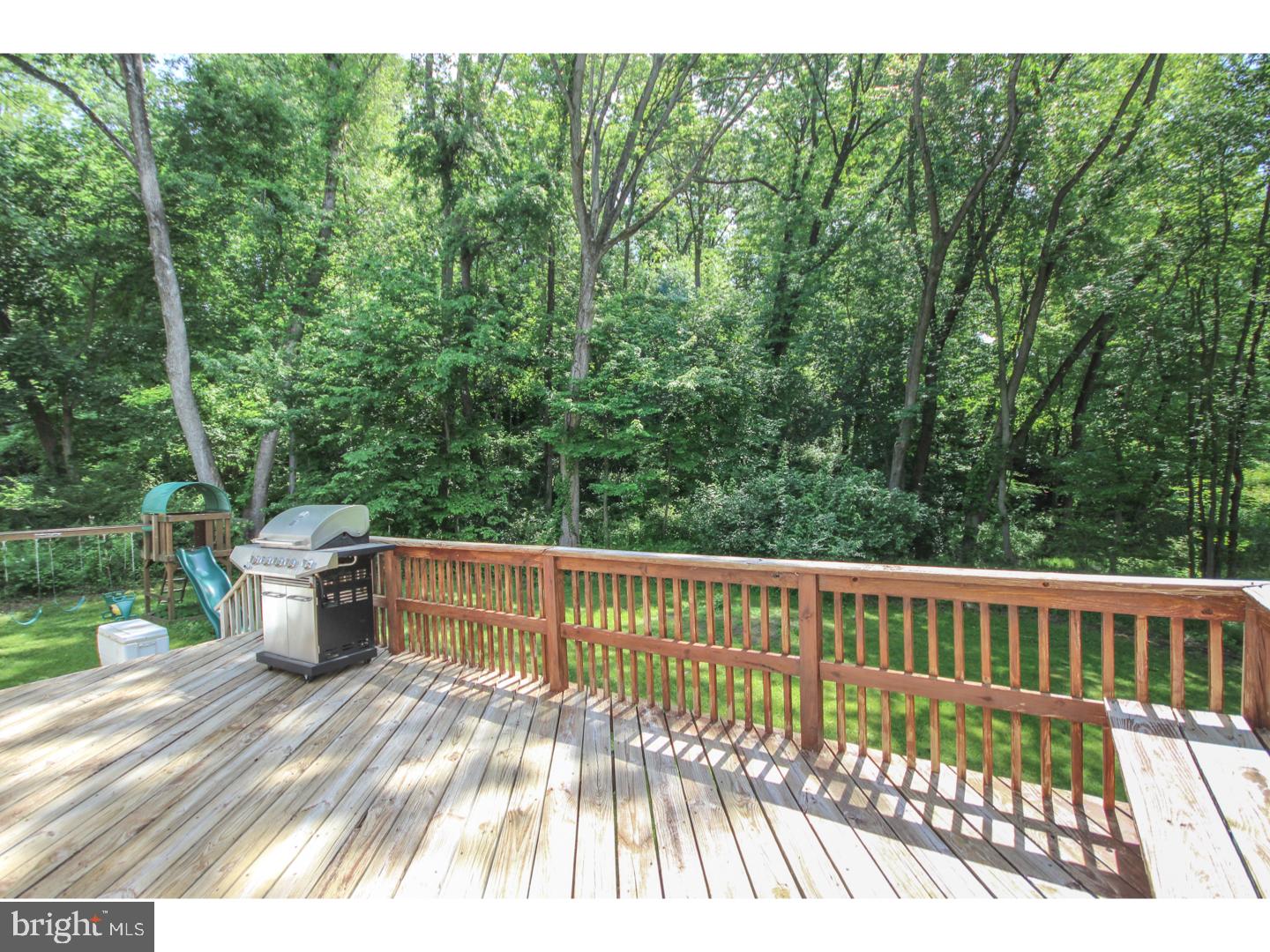 1010 Glen Road Wallingford, PA 19086 - Photo 19 of 20 a view of a wooden deck and a yard