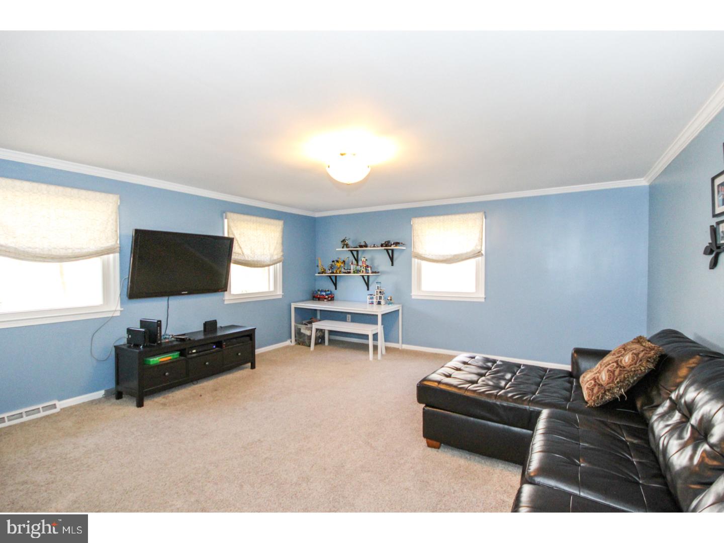1010 Glen Road Wallingford, PA 19086 - Photo 6 of 20 a living room with furniture and a flat screen tv