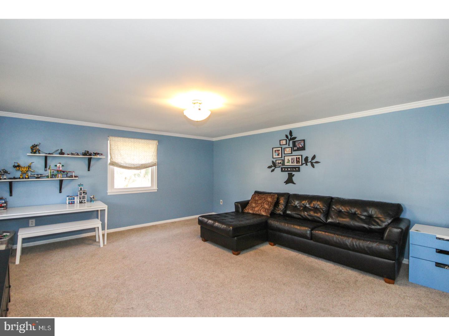 1010 Glen Road Wallingford, PA 19086 - Photo 7 of 20 a bedroom with a bed and a window