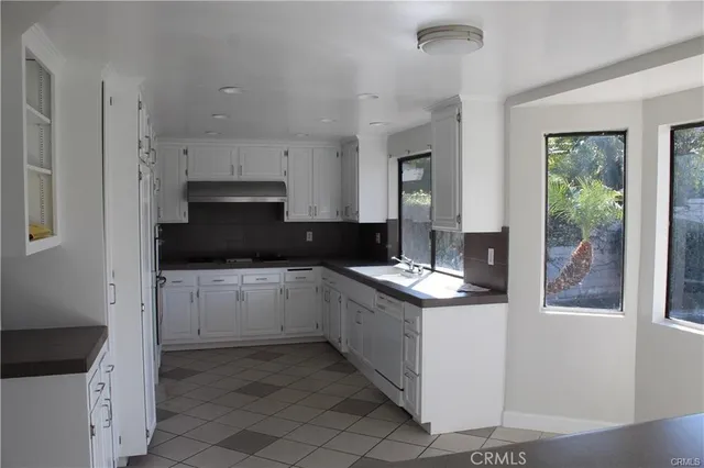 a kitchen with a stove and a sink