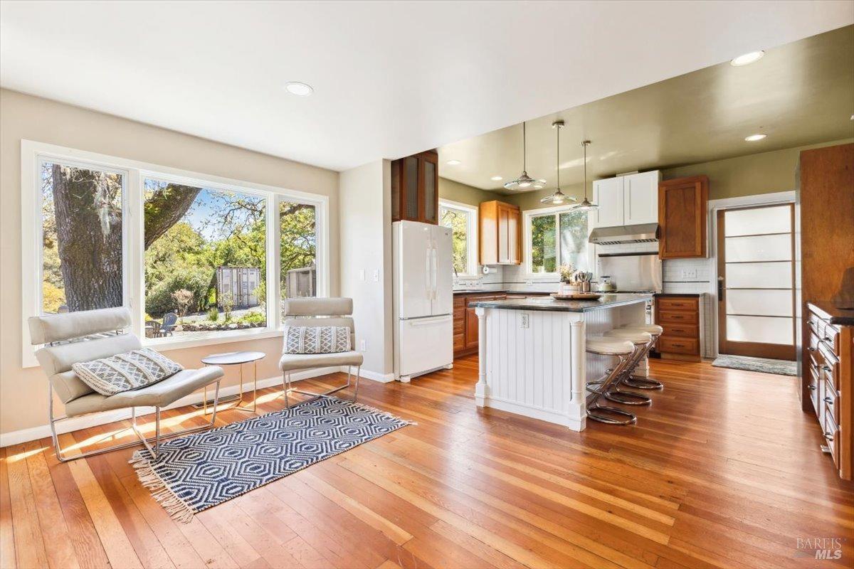 4820 Bennett Valley Road Santa Rosa, CA 95404 - Photo 10 of 65 Kitchen of the main house featuring stone countertops, chef's island, and Viking range.