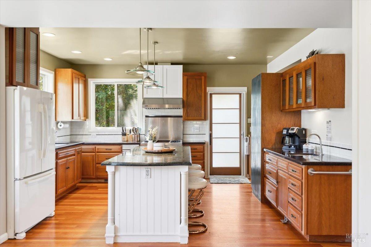 4820 Bennett Valley Road Santa Rosa, CA 95404 - Photo 8 of 65 Kitchen of the main house featuring stone countertops, chef's island, and Viking range.