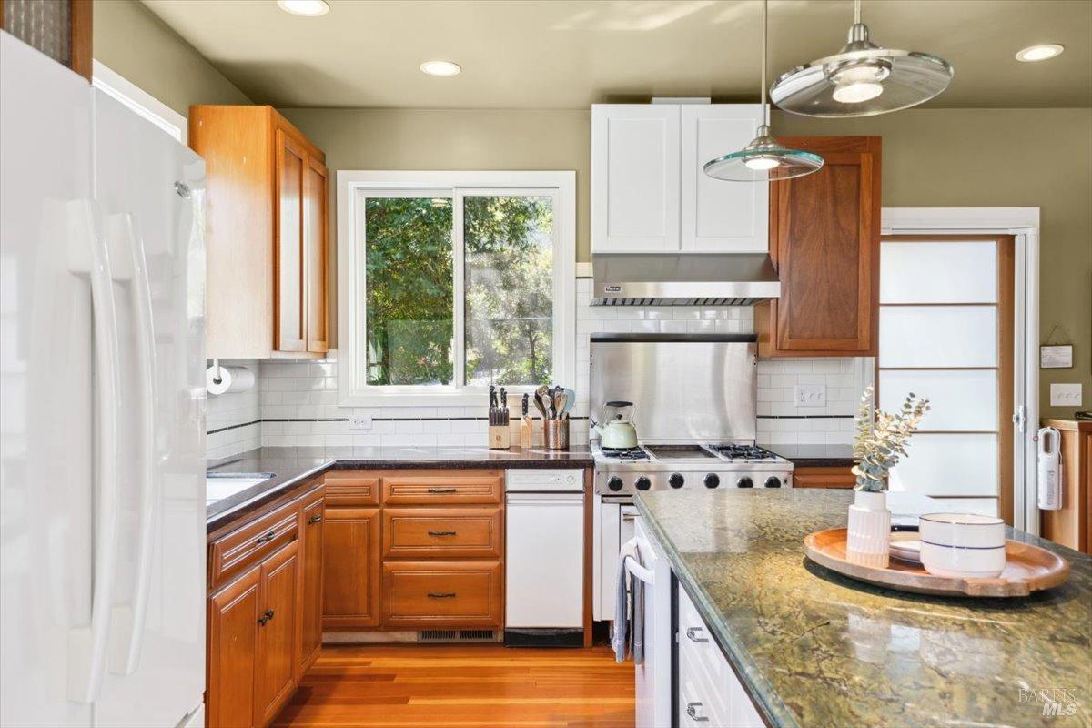 4820 Bennett Valley Road Santa Rosa, CA 95404 - Photo 9 of 65 Kitchen of the main house featuring stone countertops, chef's island, and Viking range.