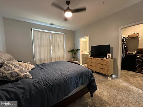 a bathroom with a double vanity sink mirror and toilet