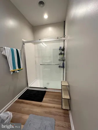 a bathroom with a double vanity sink toilet and a mirror