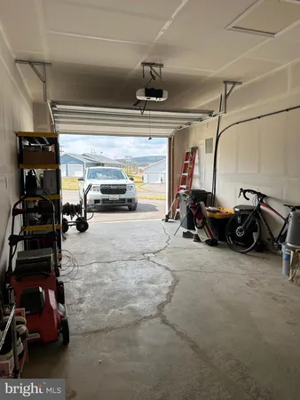 a room with gym equipment and a large window