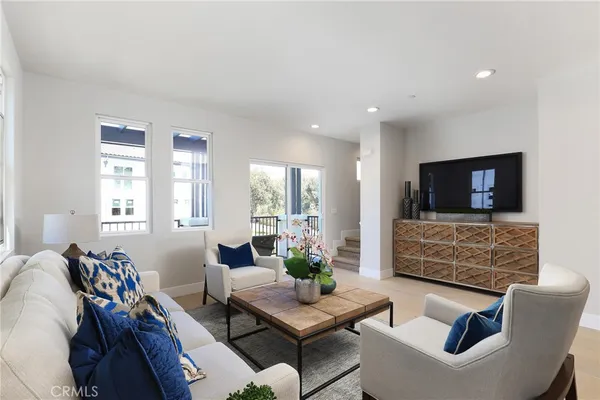 a kitchen with cabinets appliances a sink and a window