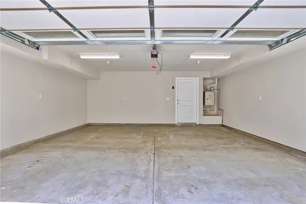 an outdoor space with patio and white umbrellas