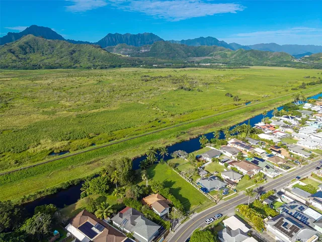 a view of an ocean and a mountain