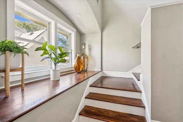 a view of staircase with wooden floor