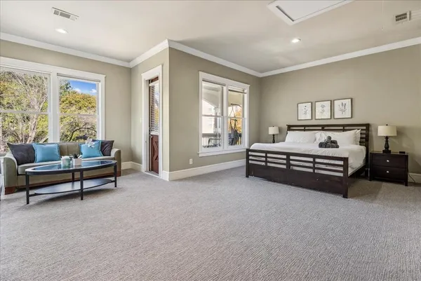 a bedroom with furniture and window