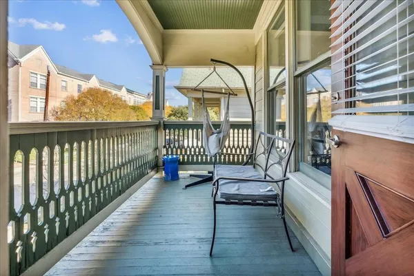 a view of a balcony with chairs