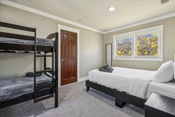 a bedroom with a bed and a cabinets