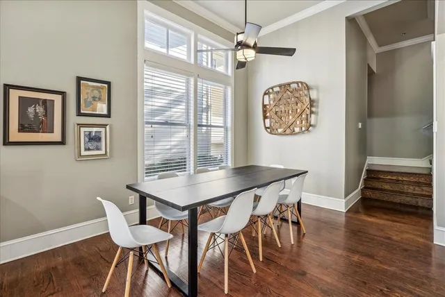 a view of a dining room with furniture wooden floor and chandelier