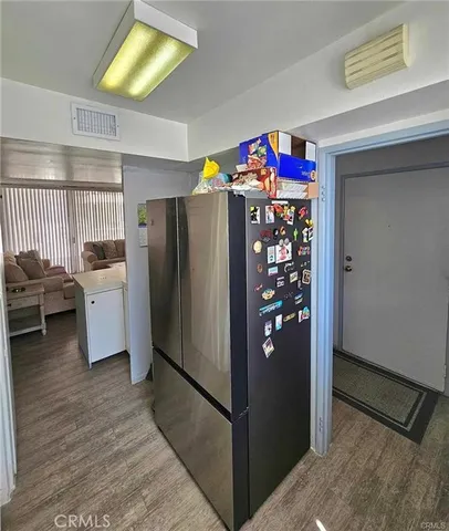 a kitchen with cabinets appliances and a sink