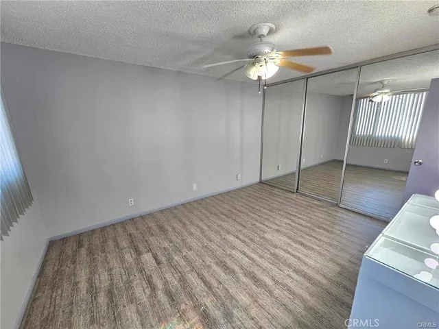 a bathroom with a sink mirror and a toilet