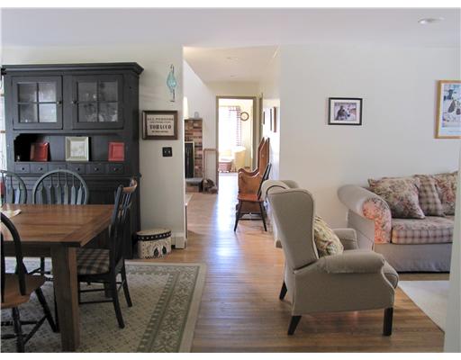 3 High Meadow Road Little Compton, RI 02837 - Photo 11 of 20 Dining Room. This is looking at the space where the front living room and dining room merge looking towards in towards the living room, MBR and quilting room at east end of house.