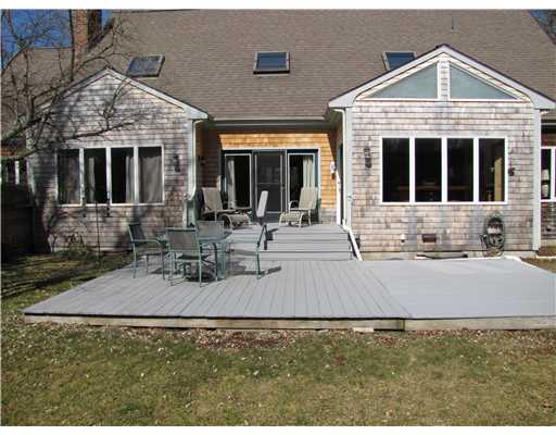3 High Meadow Road Little Compton, RI 02837 - Photo 4 of 20 Exterior Back. Wooden deck off of dining room and kitchen leads out to large landscaped yard.. New shingles in 2010.
