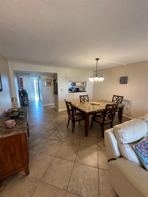 401 150th Avenue, Unit 266 Madeira Beach, FL 33708 - Photo 15 of 46 a view of a dining room with furniture