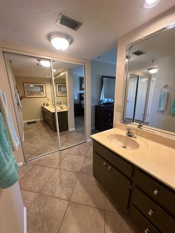 401 150th Avenue, Unit 266 Madeira Beach, FL 33708 - Photo 26 of 46 a bathroom with a sink and a mirror