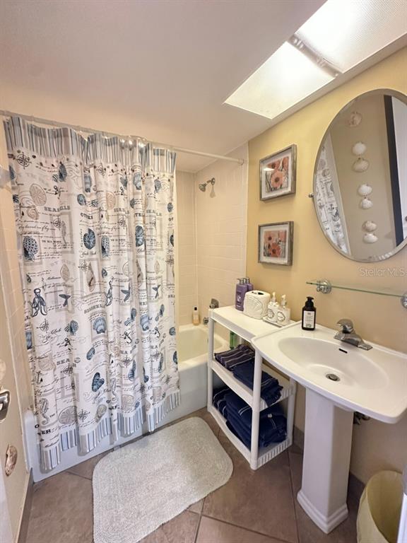 401 150th Avenue, Unit 266 Madeira Beach, FL 33708 - Photo 31 of 46 a spacious bathroom with a sink and a mirror