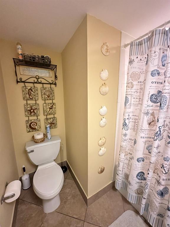 401 150th Avenue, Unit 266 Madeira Beach, FL 33708 - Photo 32 of 46 a bathroom with a toilet and a shower