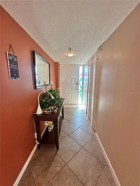 401 150th Avenue, Unit 266 Madeira Beach, FL 33708 - Photo 33 of 46 a room with furniture and a potted plant
