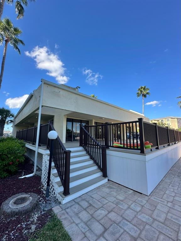 401 150th Avenue, Unit 266 Madeira Beach, FL 33708 - Photo 34 of 46 a view of a house with a yard