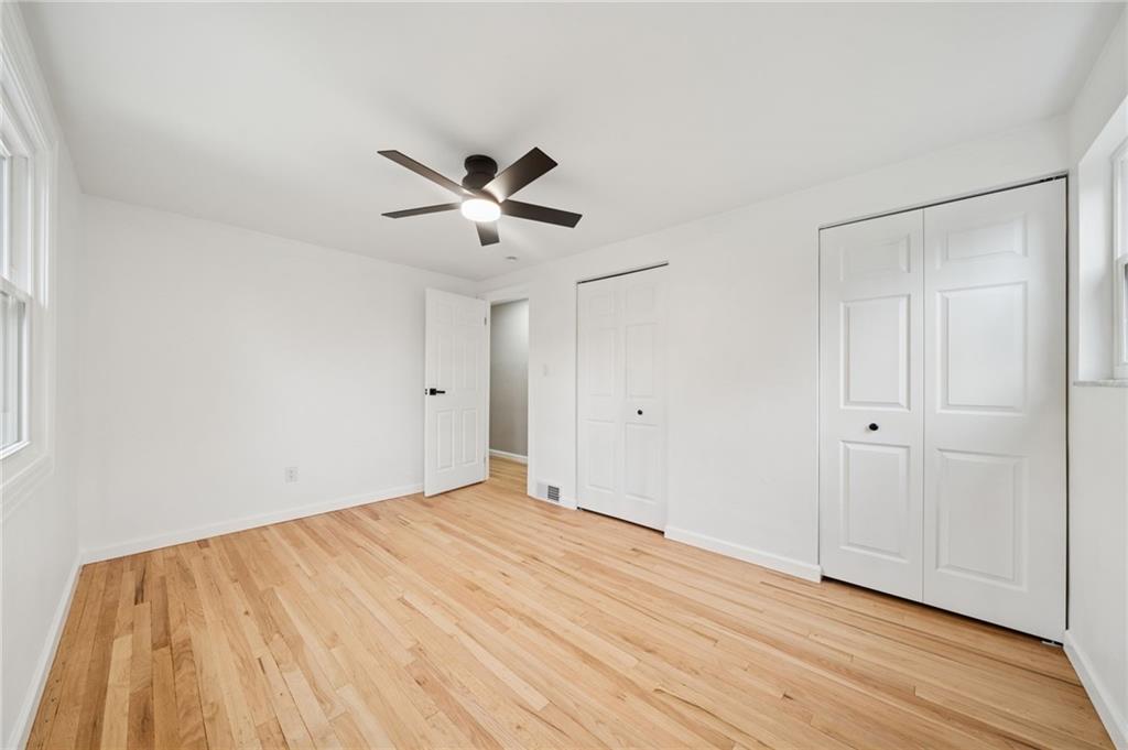 1714 O'Block Road Pittsburgh, PA 15239 - Photo 23 of 36 a view of an empty room with wooden floor