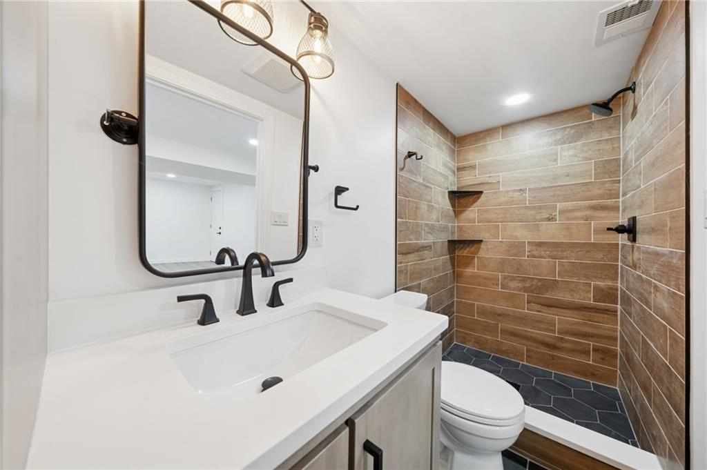 1714 O'Block Road Pittsburgh, PA 15239 - Photo 28 of 36 a bathroom with a sink a toilet and shower