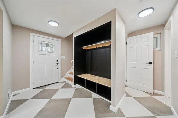 a hallway with windows and stairs