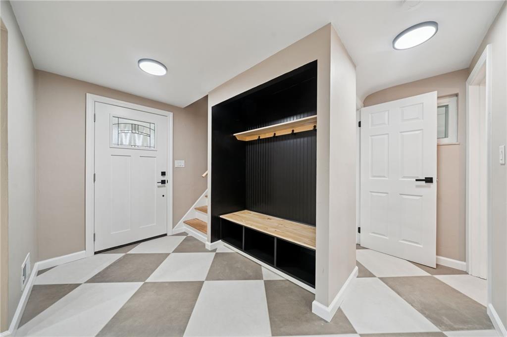 1714 O'Block Road Pittsburgh, PA 15239 - Photo 4 of 36 a hallway with windows and stairs