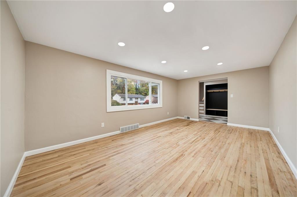 1714 O'Block Road Pittsburgh, PA 15239 - Photo 6 of 36 a view of an empty room with wooden floor and a window