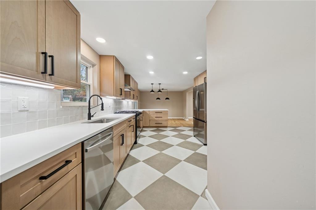 1714 O'Block Road Pittsburgh, PA 15239 - Photo 10 of 36 a large kitchen with a sink and cabinets